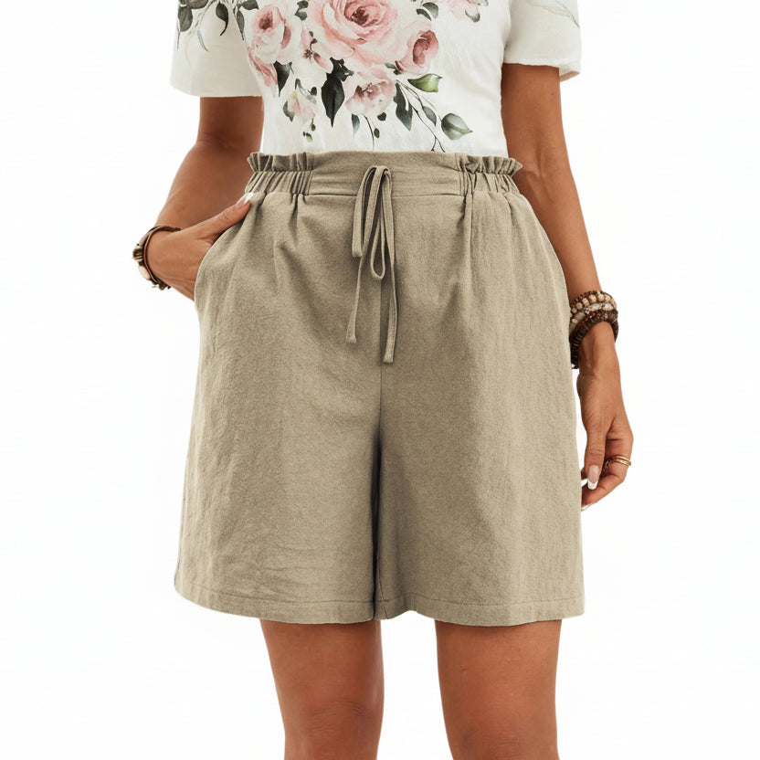 Short en lin pour femme couleur unie, coupe ample avec cordon. Parfait pour un look décontracté et léger au printemps-été.