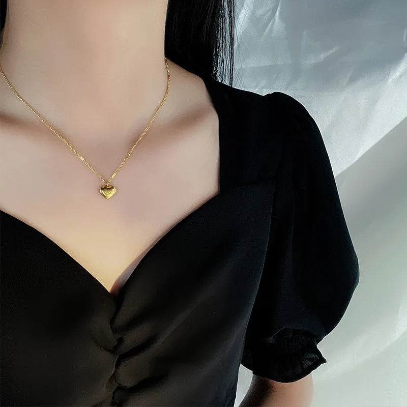 Collier pendentif cœur en métal plaqué or pour femme