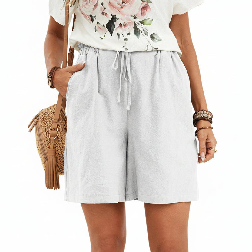 Short en lin pour femme couleur unie, coupe ample avec cordon. Parfait pour un look décontracté et léger au printemps-été.