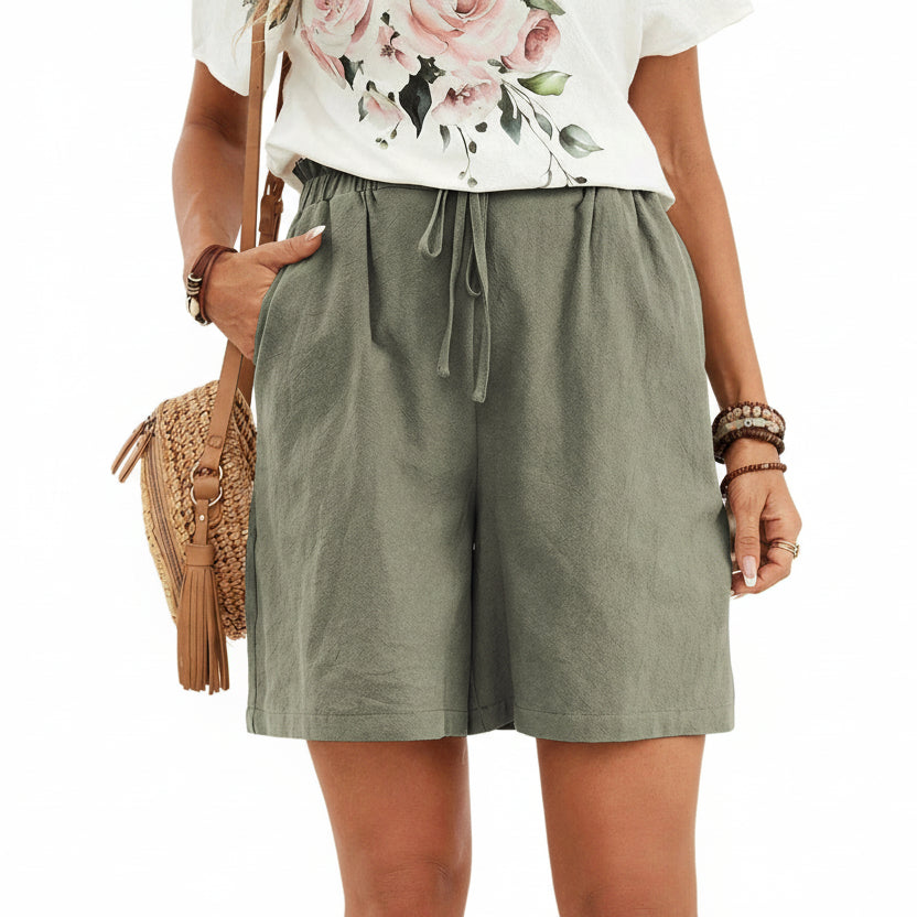 Short en lin pour femme couleur unie, coupe ample avec cordon. Parfait pour un look décontracté et léger au printemps-été.