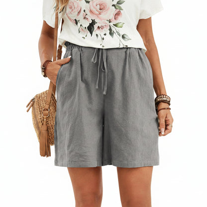 Short en lin pour femme couleur unie, coupe ample avec cordon. Parfait pour un look décontracté et léger au printemps-été.